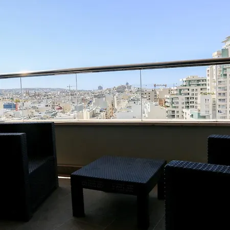 Отель The Seafront Tower Suites Слима